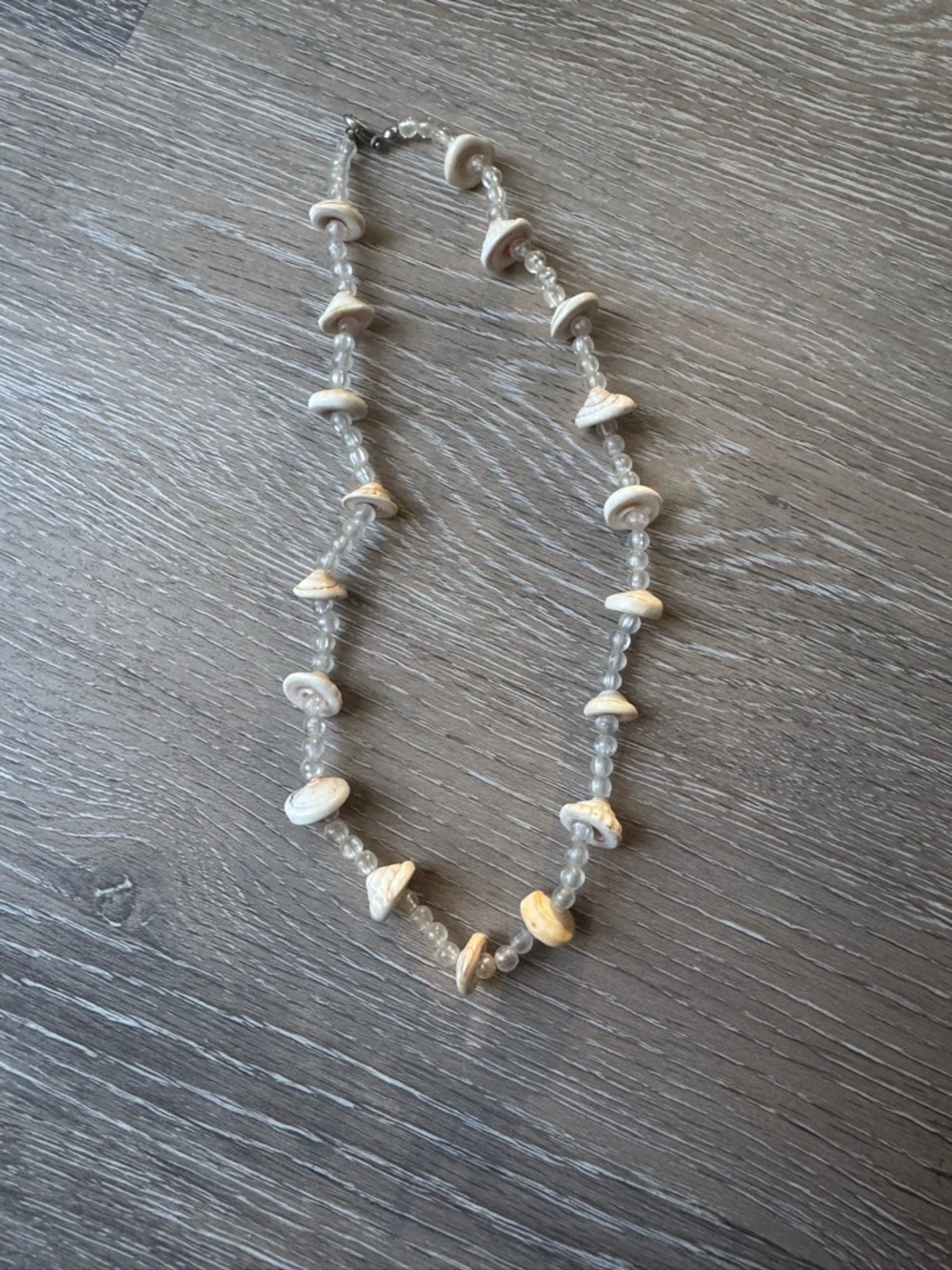 Round puka shell and glass bead necklace